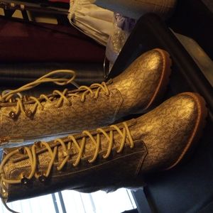 Brand new Michael Kors Boots size 9. Gold in color